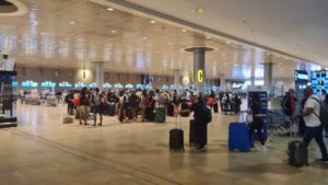 flying the coronavirus - the not too crowded airport hall