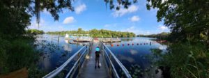 Jannaeus on the tour boat pier on the river flowing out of the spring - Blue Spring