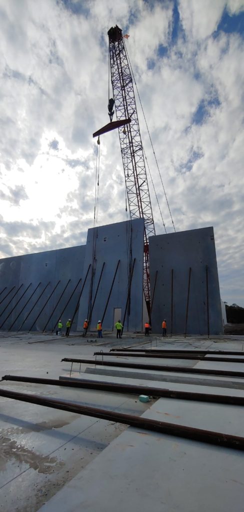 A method of construction I was not familiar with, till the friend in Florida told me about - you cast the concrete walls on the ground around the building and lift it up. The inner space will be covered by light steel roof on steel columns. - American construction