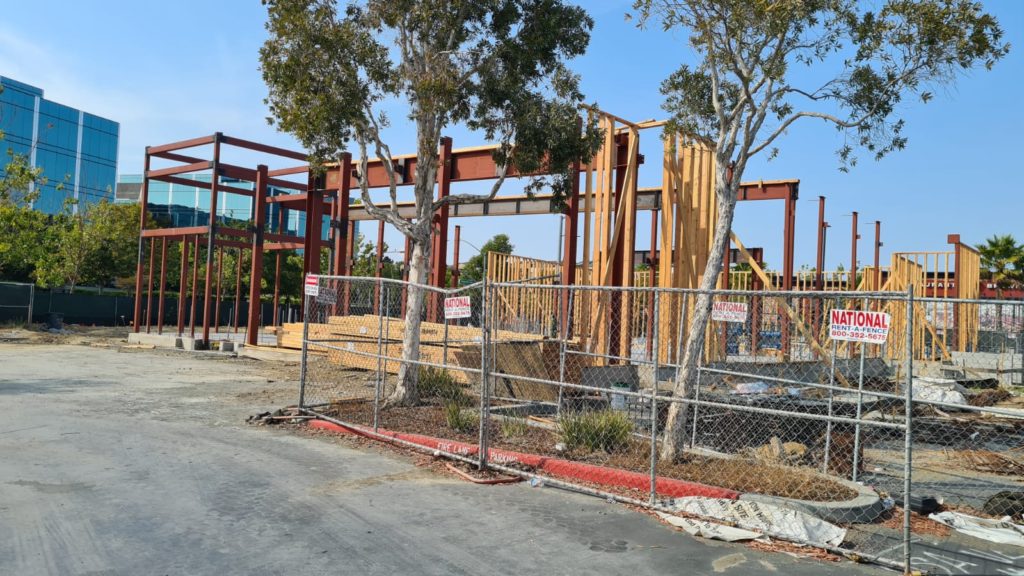 A building made part from mixed steel and wood in one of California endless shopping centers. I am not used to have the skeleton from wood at all. - American construction
