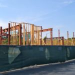 A building made part from mixed steel and wood in one of California endless shopping centers. I am not used to have the skeleton from wood at all. - American construction