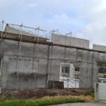 10m high Hollow concrete masonry walls with almost no concrete beams or columns, I wonder how the code allows it