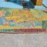 The scenes on the mosaic on the curve around the fountain