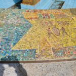 The scenes on the mosaic on the curve around the fountain