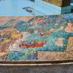 The scenes on the mosaic on the curve around the fountain