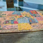 The scenes on the mosaic on the curve around the fountain
