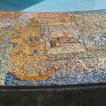 The scenes on the mosaic on the curve around the fountain