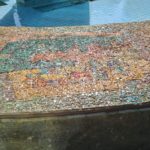 The scenes on the mosaic on the curve around the fountain