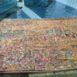 The scenes on the mosaic on the curve around the fountain