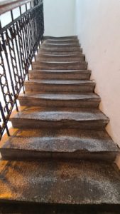 The stairs, worn from 100 years of use