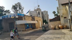 Town hall on the back, looks not related to older buildings. And an British Mandate time building in front.