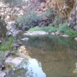 Between the second and third waterfall