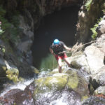 Rappelling down the third waterfall - 20m high with positive slope. On the bottom there is a 50m long pool