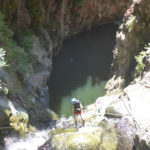 Rappelling down the third waterfall - 20m high with positive slope. On the bottom there is a 50m long pool