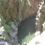 Rappelling down the third waterfall - 20m high with positive slope. On the bottom there is a 50m long pool