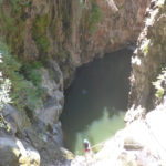 Rappelling down the third waterfall - 20m high with positive slope. On the bottom there is a 50m long pool