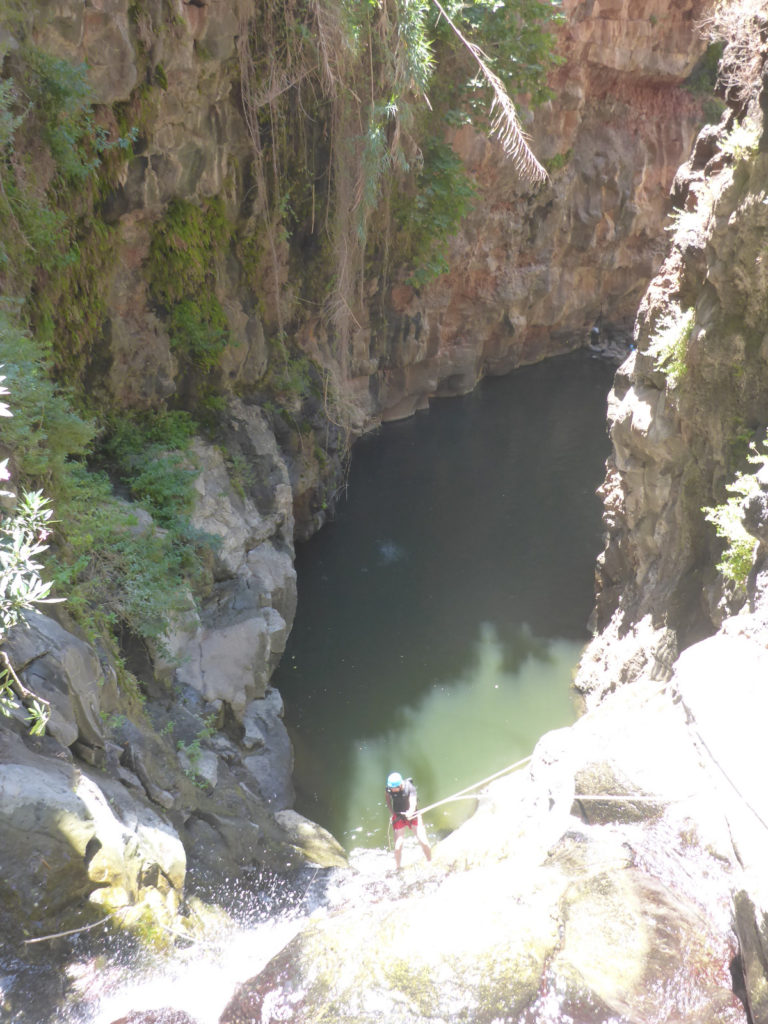 Rappelling down the third waterfall - 20m high with positive slope. On the bottom there is a 50m long pool