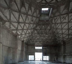 One of the silos before renovation - the roof is concrete truss and the walls are arched to hold the grain pressure (Source: Tarbutandthecity.com) - Bnei Barak Grain silos