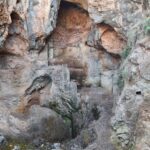 A rock hold by steel cables just above the trail - Nahal Me'arot