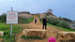 And we start climbing it. The sign says the way is to walk around the hill to Abu-Kishk ruins where the trail up starts. Nobody is walking around and the sign is to remove responsibility from the municipality as this way is not safe. . - Hod-Hasharon Ecological Park