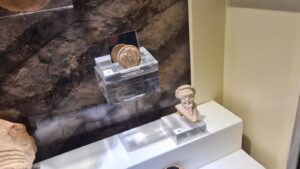 An ivory coin for the theater (the mirror shows the coin back with the row and seat number) in the Mizgaga