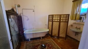 The bathroom. On the left is the dress Shara asked to be hanged in Damascus in, near it is the coal boiler and a sink with running water (both were luxurious and rare back then). On the floor you can a see the man weight they were using - Nili