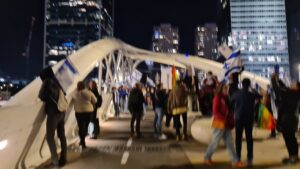 Singing, clamping, and drumming over the closed Ayalon highway.