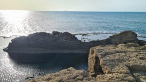 The Kurkar rock on the water looks cut down by human, but not clear for what purpose
