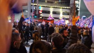 Right wing protestors raising a sign saying "Left wing are traitors" - 11th week