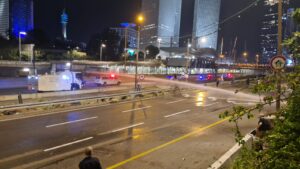 The Makhtazit uses its water canon in an attempt to prevent the protestors from going down to Ayalon Highway