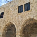 Retrofitting the castle: holding the bottom of the arches (by adding an element that can stand tension on the bottom of the arches) and holding the columns by adding confining steel hoops to hold the columns.