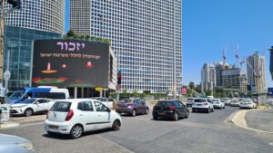 Yizkhor sign on Azireali center above Azrieli junction - siren