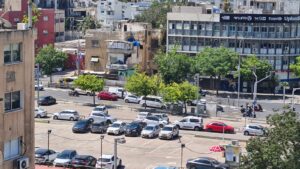 People stands still in Tel Aviv during the siren