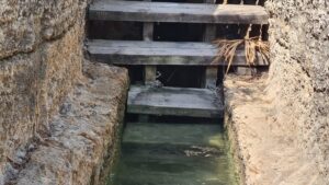 A water curb on the wooden stairs