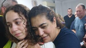 Private Ori Megidish with her mother at their house in Kiryat Gat after being rescued