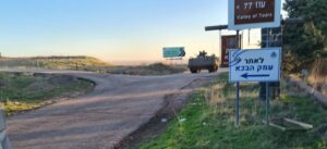 The sign to Memorial site of the Valley of Tears and a Nagmash coming back from a mission