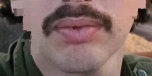 With a mustache