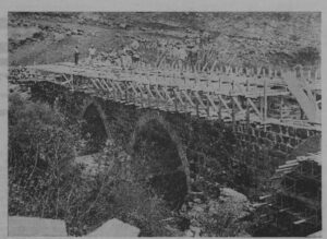 Maatz (PWD) restoring now an old Roman bridge on the Hasbani stream. The border with Lebanon now pass on the bridge (Source: www.nli.org.il)