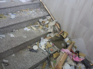 The rubbish and ruins left on the steps of the building we walked into 