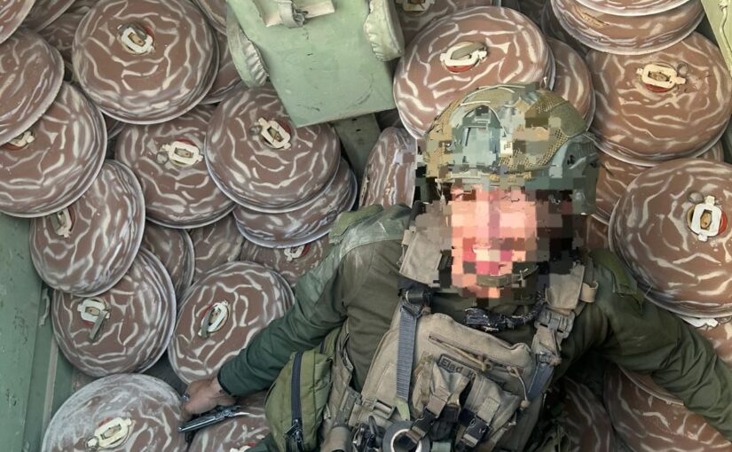 A soldier lying down in an APC full of M-29 landmines, in some point, the Engineering Corps soldiers said, the amount of explosives is so big you will evaporated - cynical