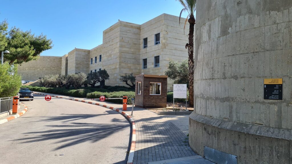 Yitzhak Rabin Center building. The sign on the stack guide you around, but says nothing about the stack it is post on. - Reading C