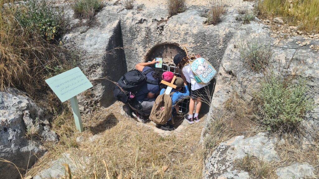Atzva, Jannaeus and Mindal trying to see what inside the cave