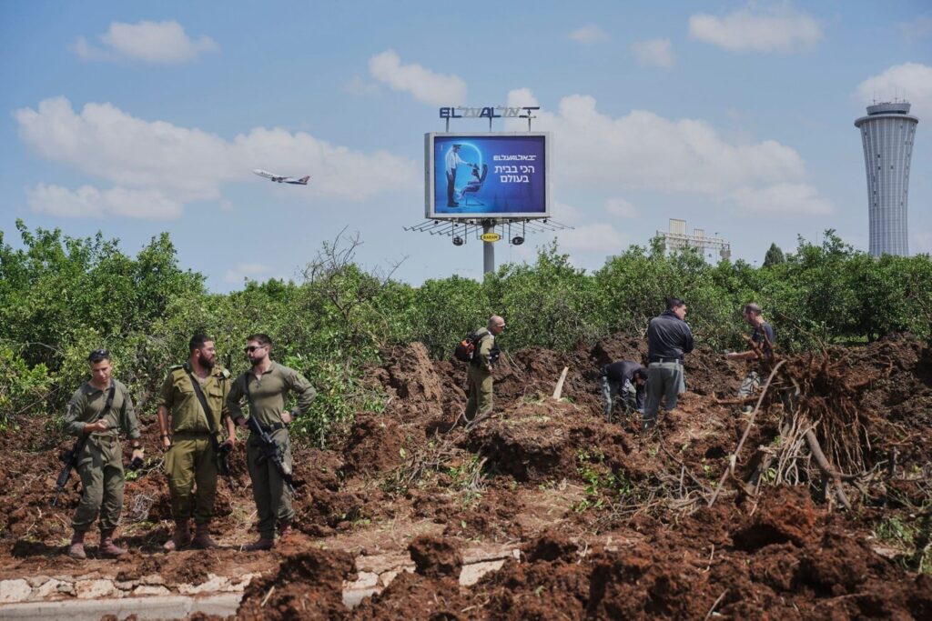 The location of the hit inside Ben Gurion Airport, the sign is for El Al (Israel flag carrier) and its slogan - The most at home in the world, which sounds a bit ironic with the missile carter in front  (Source: www.haaretz.co.il)
