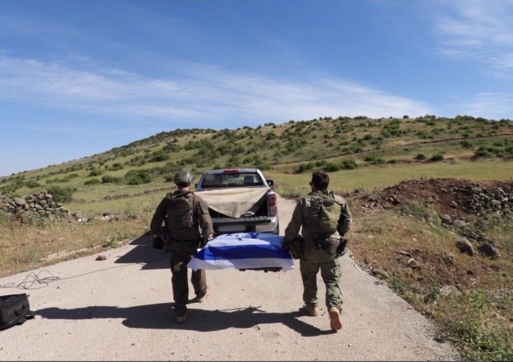 The body of Sgt.-Maj Tzvi Feldman on its way back to Israel