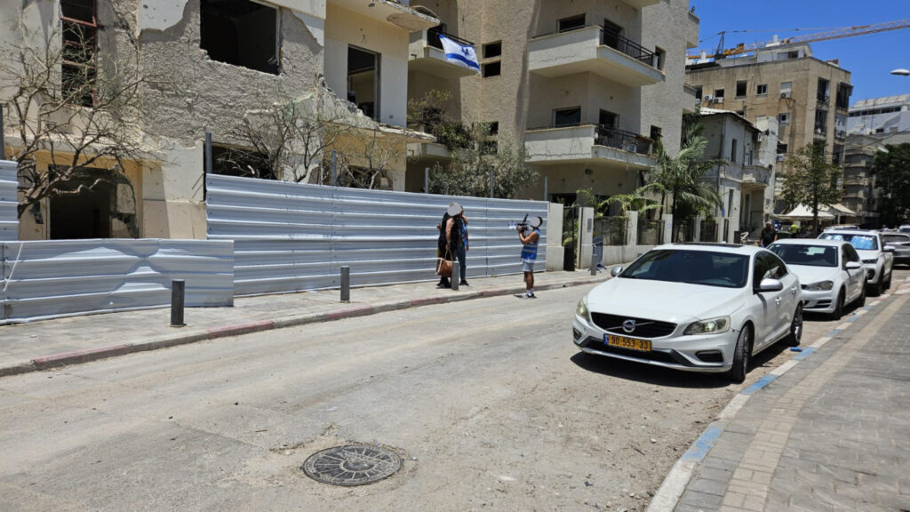 Filming and interviewing residents of a building which was damaged Iranian ballistic missile hit two days ago in Tel Aviv, near the same point the Iranian ballistic missile hit two days ago.