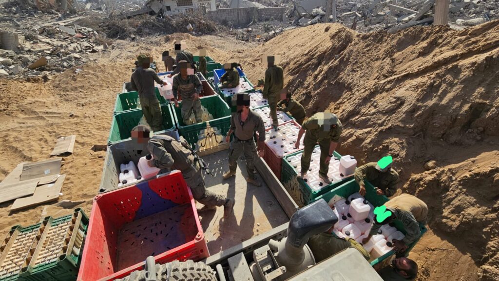 Unloading several tons of explosives from a truck (which we yesterday we loaded with couple of tons of explosives) - porters