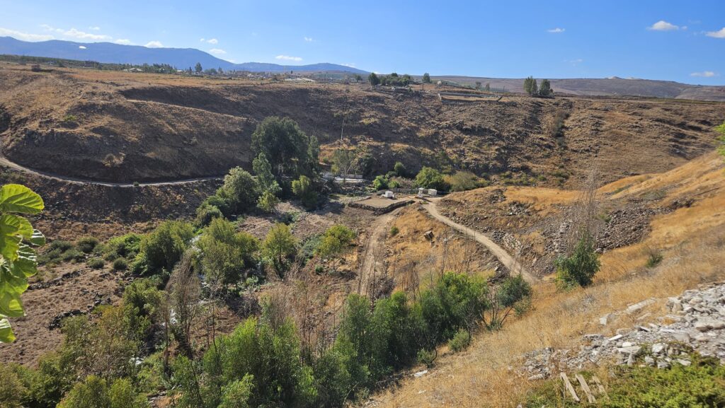 Panorama view from the walkway over the Hasbani river, the Wazzani springs and the flour mill on the stream - North part - You can see th UN post on the Wazzani springs and the road going down to it from the village