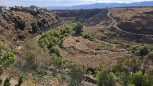 Panorama view from the walkway over the Hasbani river, the Wazzani springs and the flour mill on the stream - Looking South - You can see the flour mill and the tunnel that led water to it