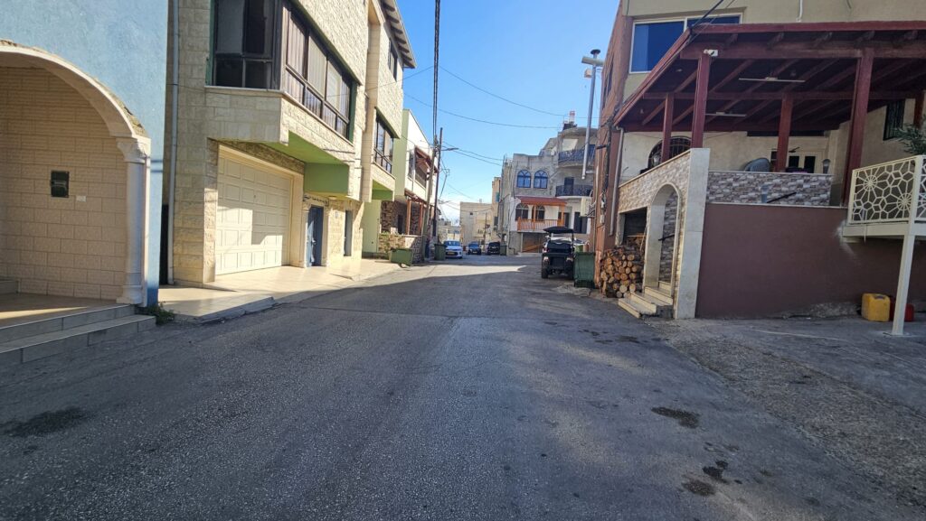 The village is Alawit, and like many villages in Israel it is built without a clear plan, for example you can see there are no sidewalks. - visit in Ghajar