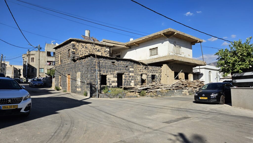 An old building made partly from Basalt stone in the southern (older) part of the village